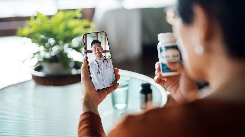 woman talking to doctor smartphone