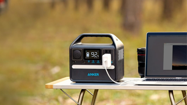 Power station sitting on table with MacBook plugged in