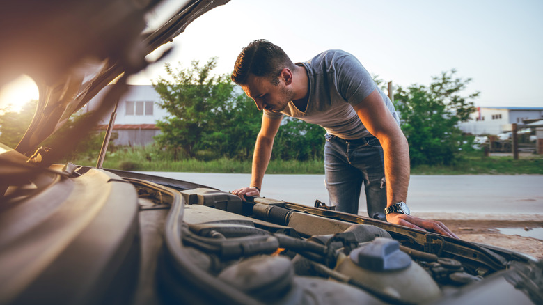 Man Checking Engine