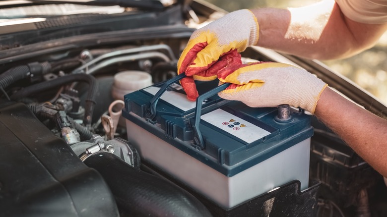 man changing a car battery