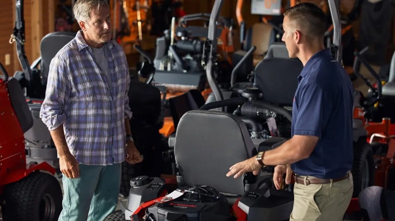 two men discussing a Kawasaki-powered zero-turn