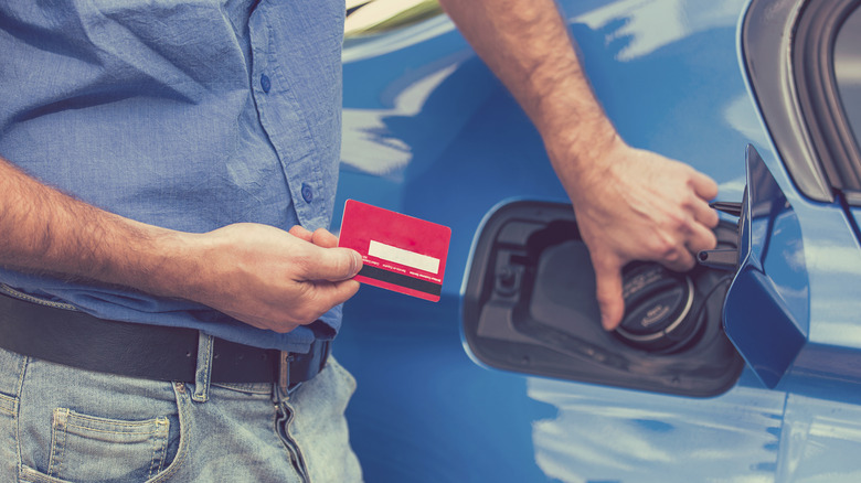 Person paying for gas