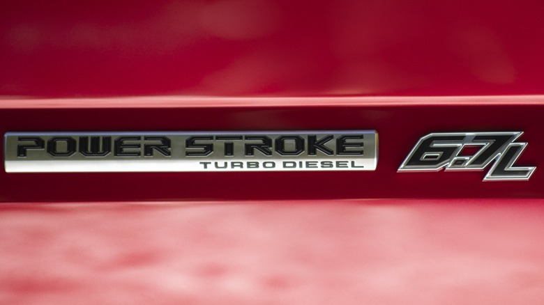 A Ford 6.7L Power Stroke Turbo Diesel badge on a Super Duty truck.