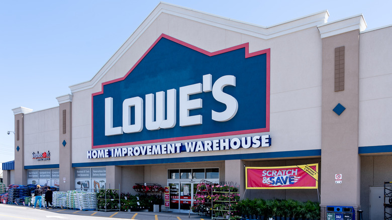 Lowe's storefront on a sunny day with flowers outside