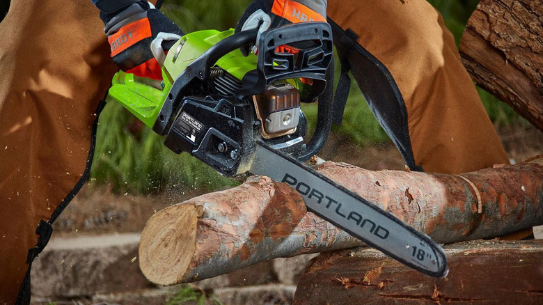 person using portland chainsaw