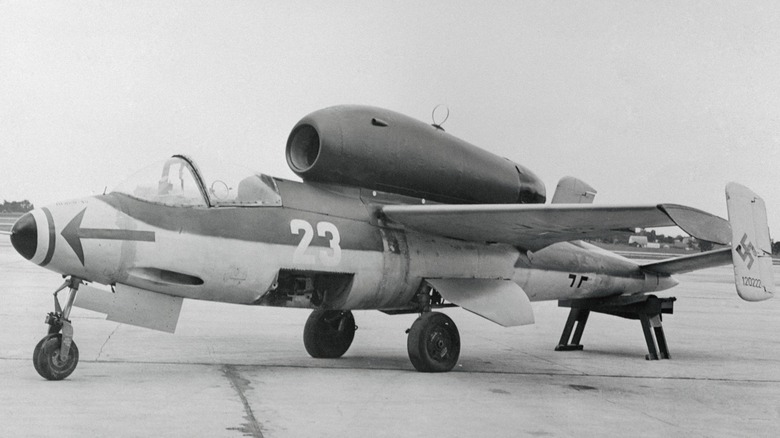 a Heinke He 162 fighter jet parking on the ramp