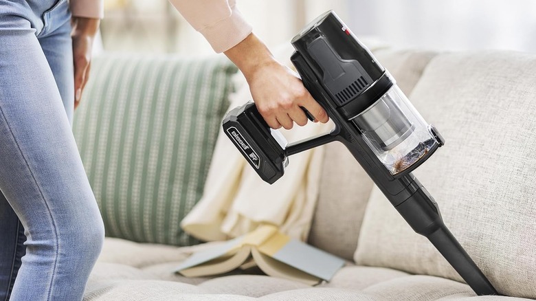 Woman using Bissell vacuum