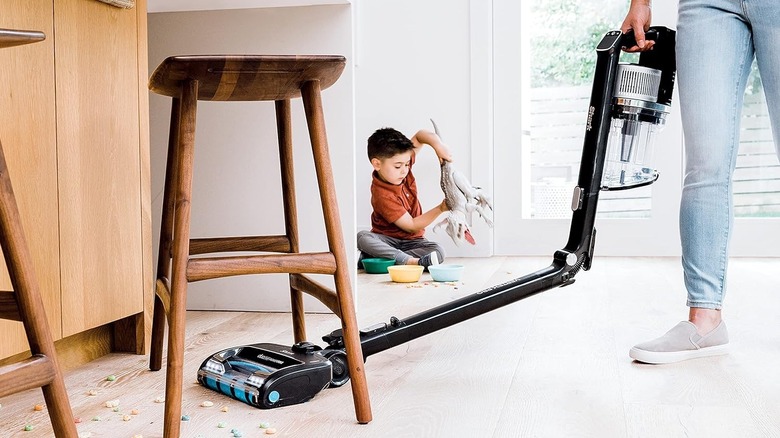 man using Shark Vertex Pro on floor