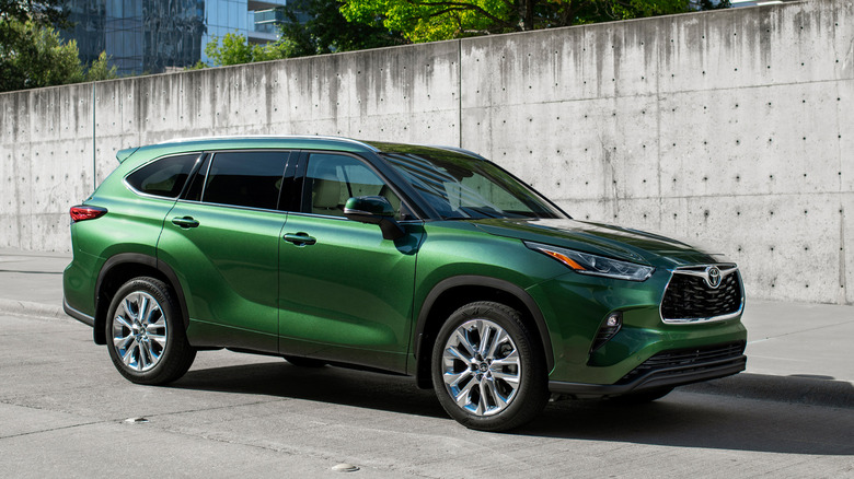 2025 Toyota Highlander parked next to a concrete wall