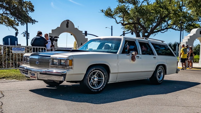 Ford Crown Victoria on a busy street