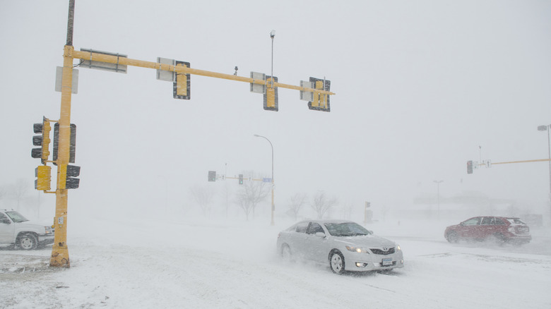 Cars on the road in a snow storm