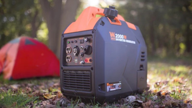 Wen generator on ground near tent