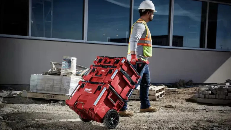 Worker pulling Milwaukee Packout system