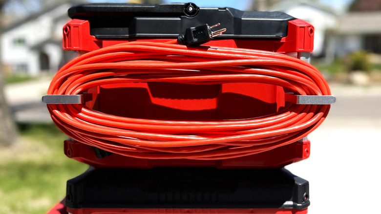 Close up image of Alpha Engineered Extension Cord Holder Organizer holding cord