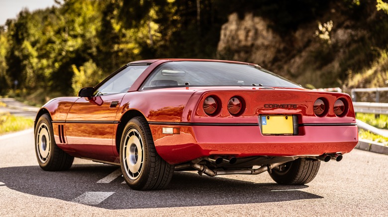 Red 1984 Chevy Corvette parked