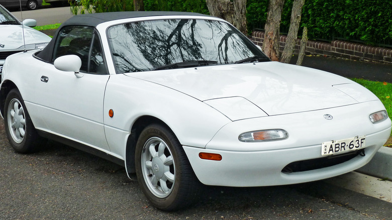 White 1992 Mazda Miata parked