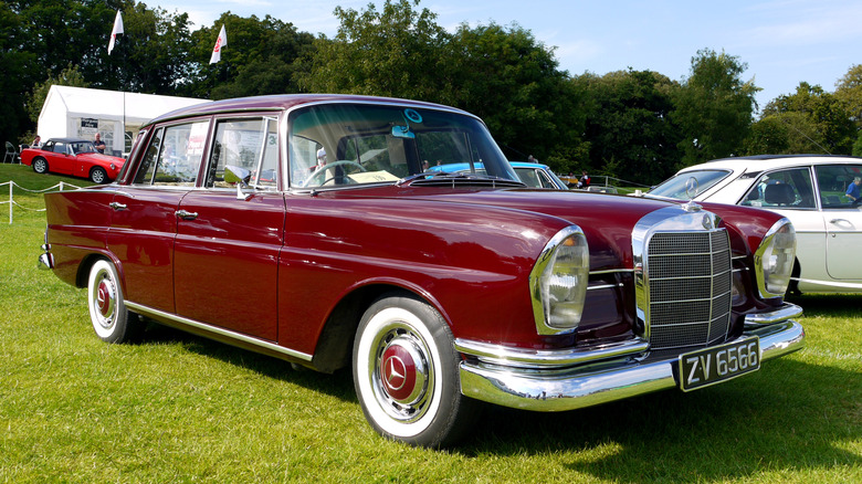 Red 1964 Mercedes 220S parked