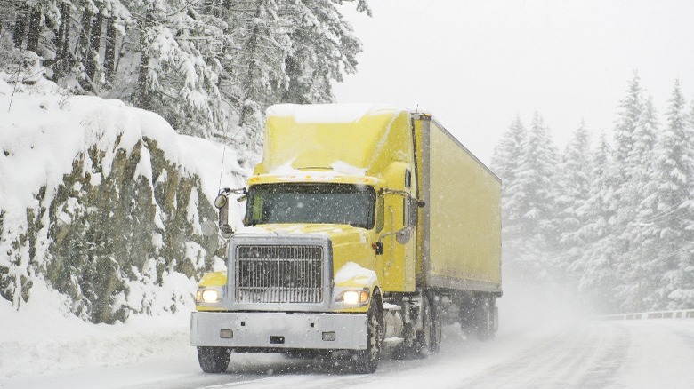 Yellow truck in the snow