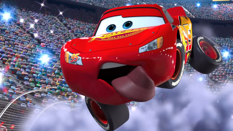 Lightning McQueen in mid-air with tongue hanging out