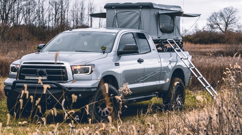 Truck with rooftop tent in wilderness