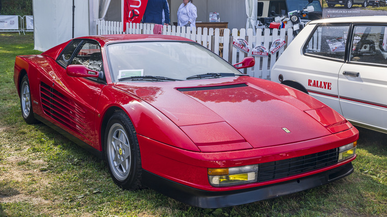 Ferarri Testarossa parked on grass