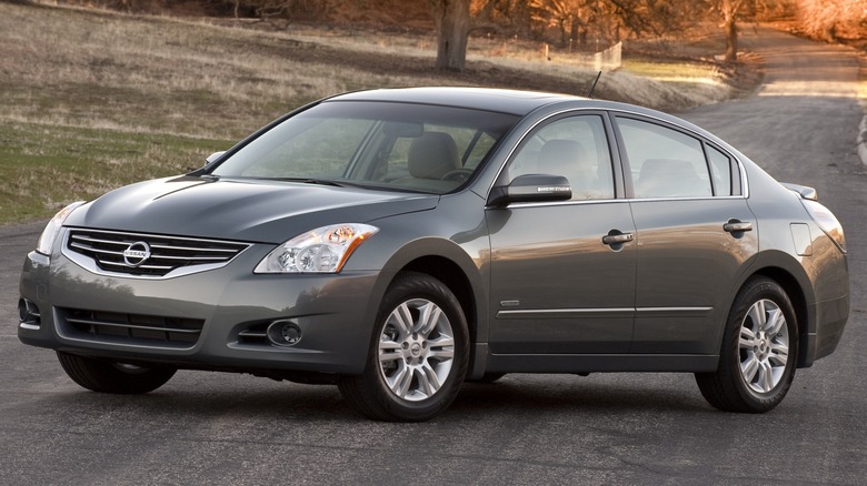 Grey Nissan Altima sedan parked on road