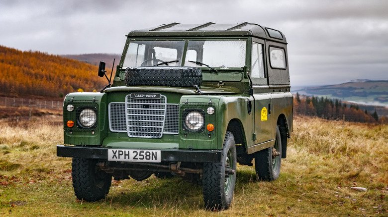 Land Rover Defender parked in grass