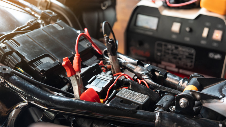 Charging motorcycle battery at garage