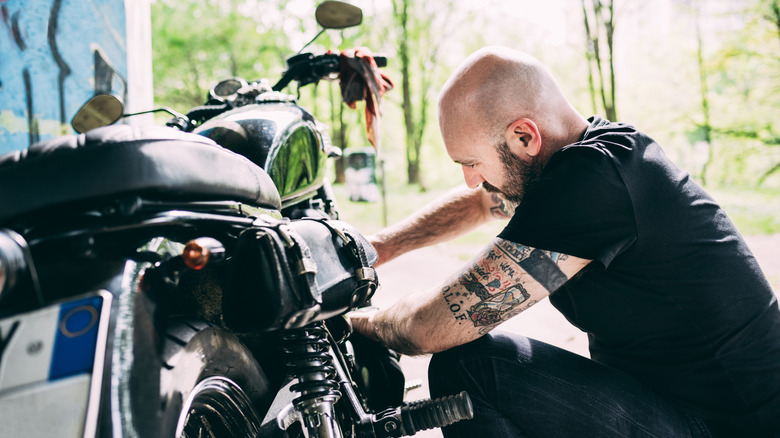 man working on a motorcycle