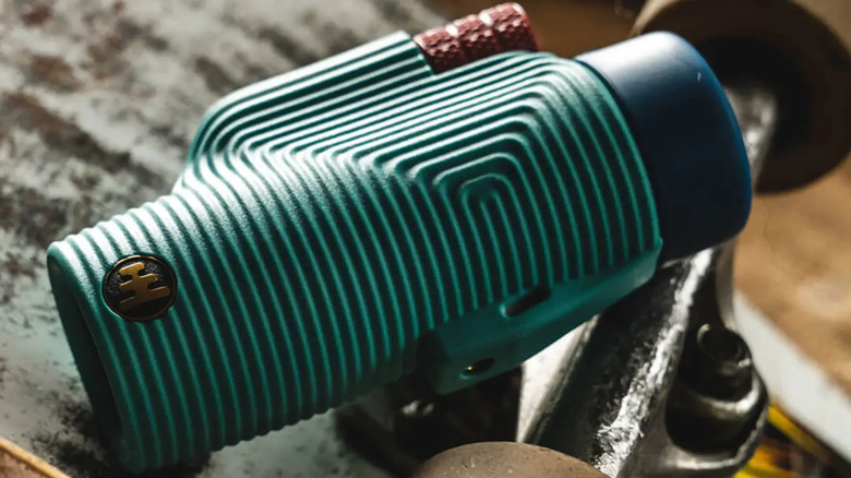 Monocular sitting on top of skateboard