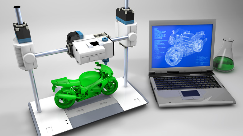 3D printer making green plastic motorcycle