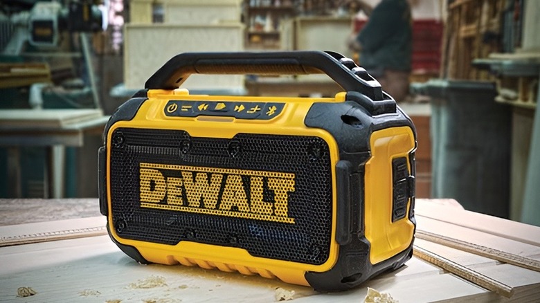 DeWalt Bluetooth speaker sitting on wooden table