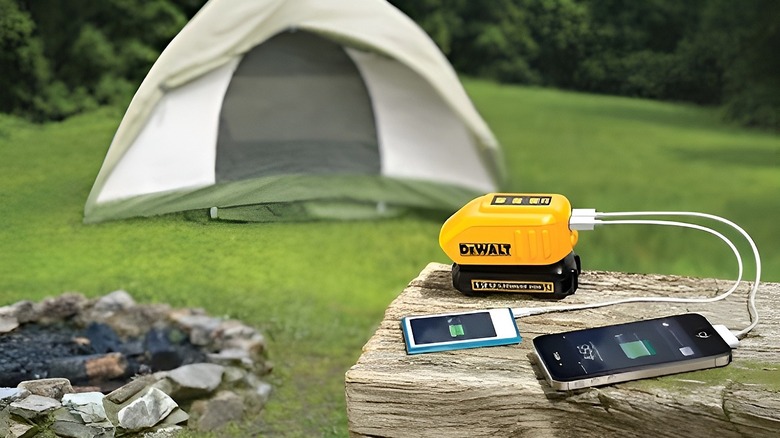 Phone charging on DeWalt charger outside of camping tent