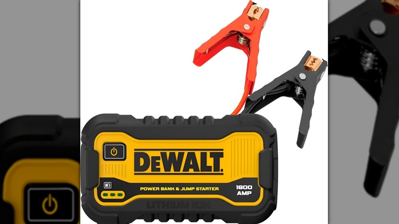 DeWalt jump starter and spark plugs on white background