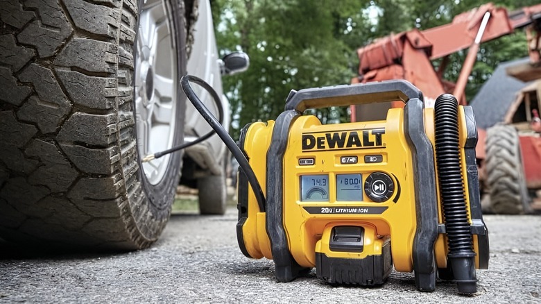 DeWalt tire inflator plugged into car tire