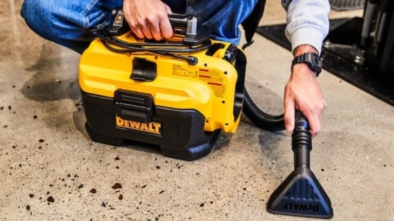 Person using 20V Max Cordless/Corded Wet-Dry Vacuum on the floor