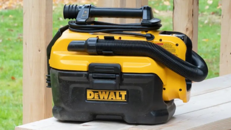 20V Max Cordless/Corded Wet-Dry Vacuum on a bench outside