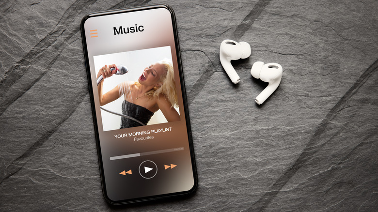 smartphone with music app and earbuds