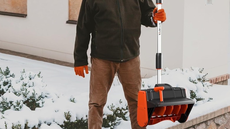 man holding cordless shovel