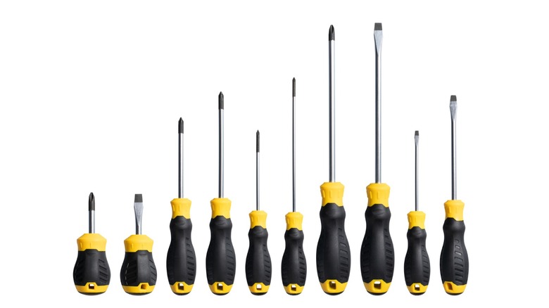 A black and yellow screwdriver set with a white background