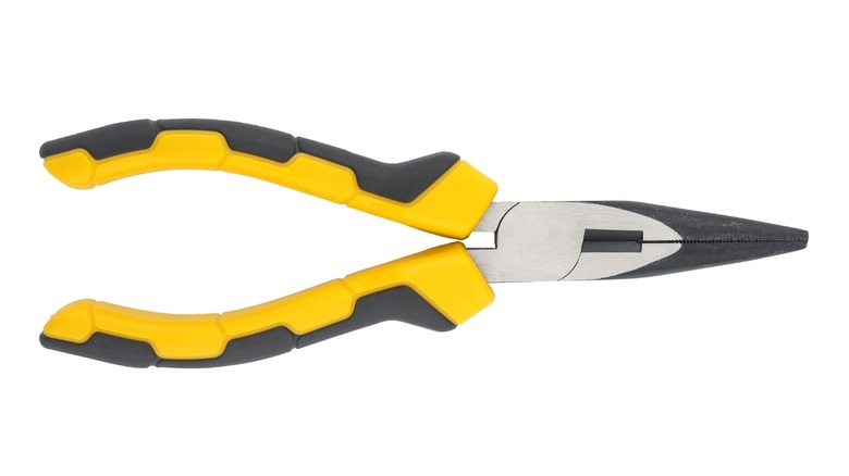 A pair of yellow-handled long nose pliers with a white background