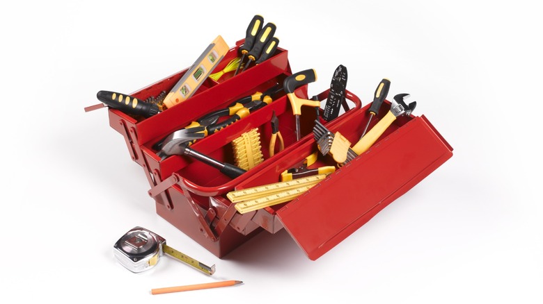 A red toolbox containing most of the basic hand tools