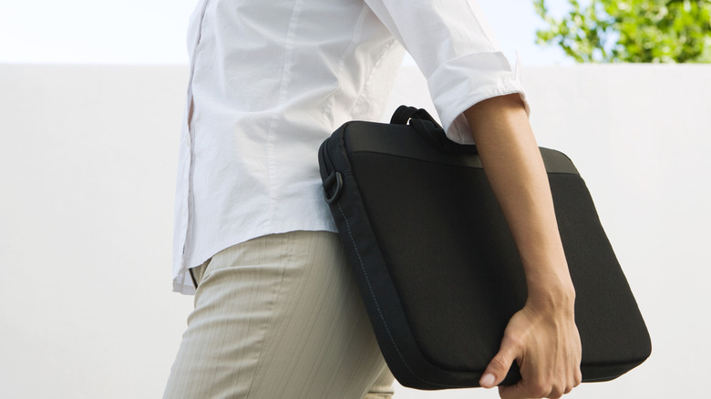 person carrying laptop case