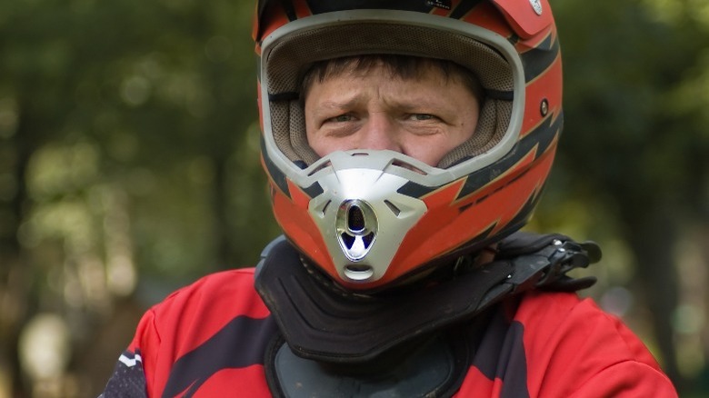 rider with neck brace