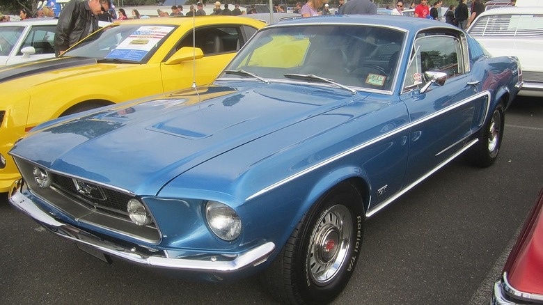 A Blue 1968 Ford Mustang GT Fastback at a car show