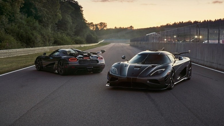 Two black Koenigsegg Agera RS cars standing still