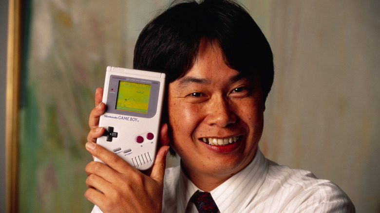 Shigeru Miyamoto with Nintendo Game Boy