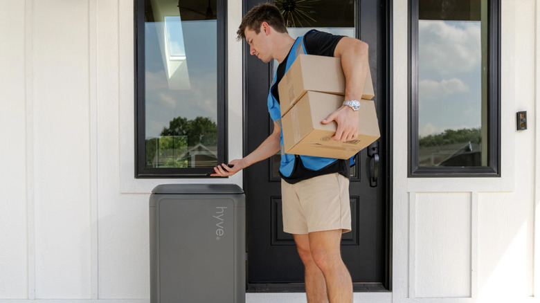 Man delivering a package to Hyve smart home delivery pod