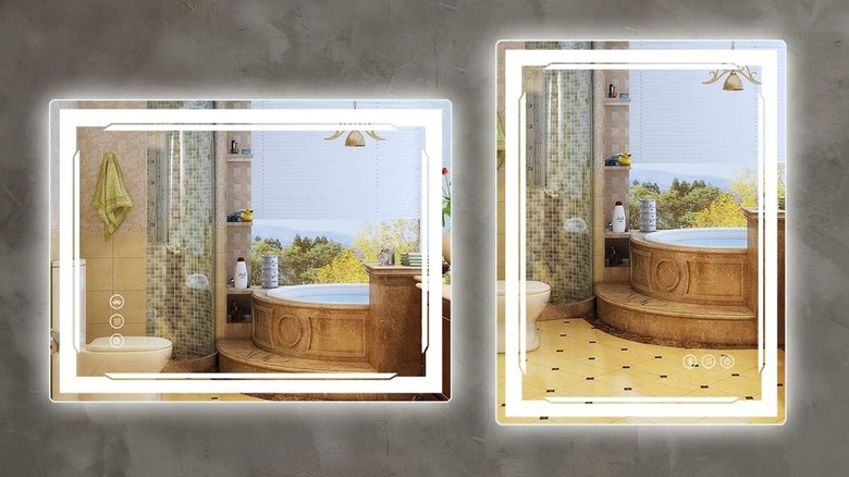 Lighted mirrors on walls with a hot tub image