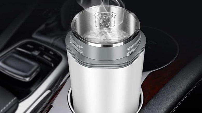 Thermos with boiling water in car cup holder